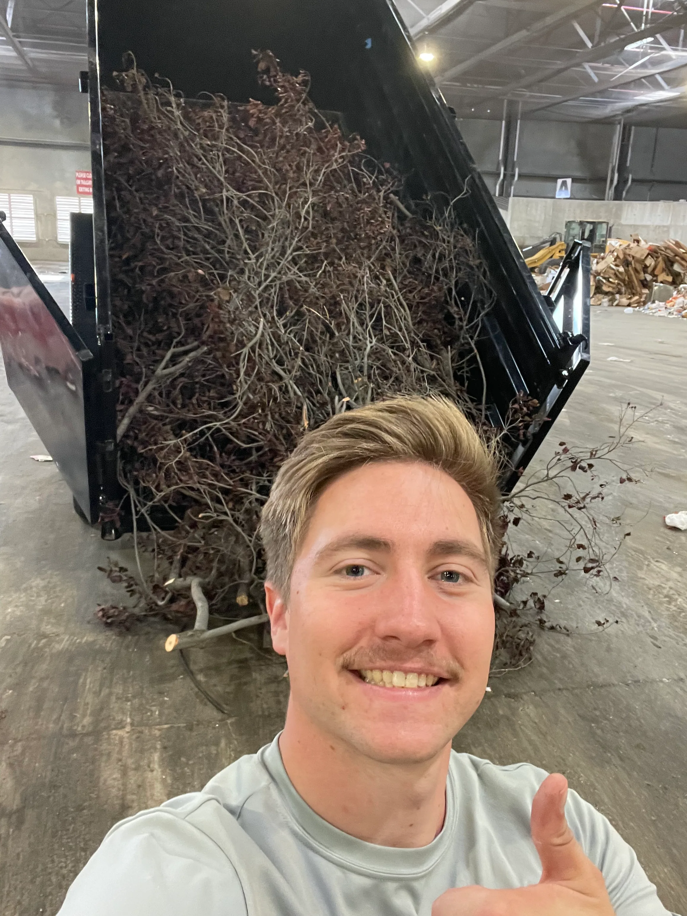Utah County hauling crew showing a full yard debris load ready for disposal