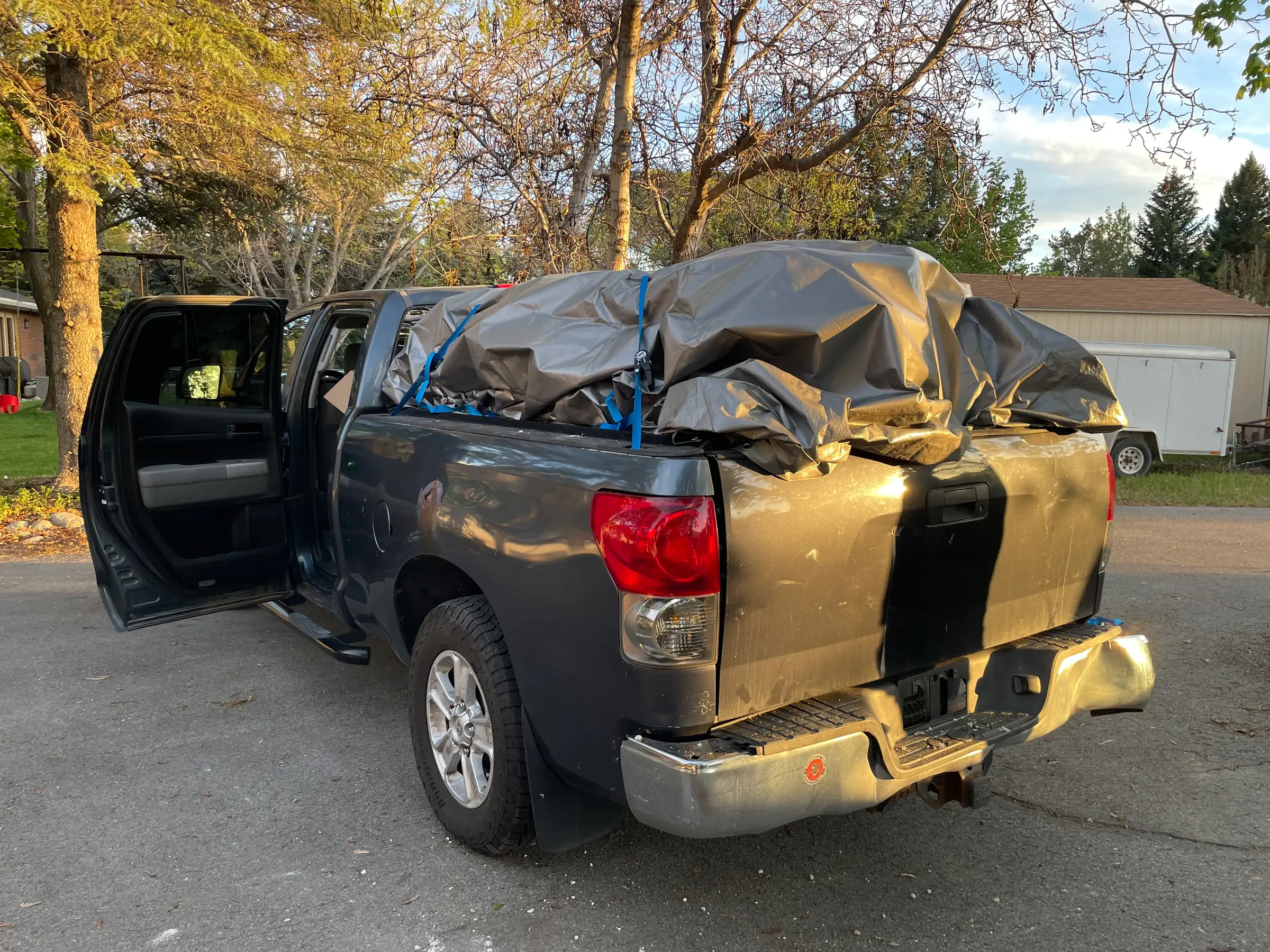 Pickup truck loaded for commercial junk hauling in Utah County