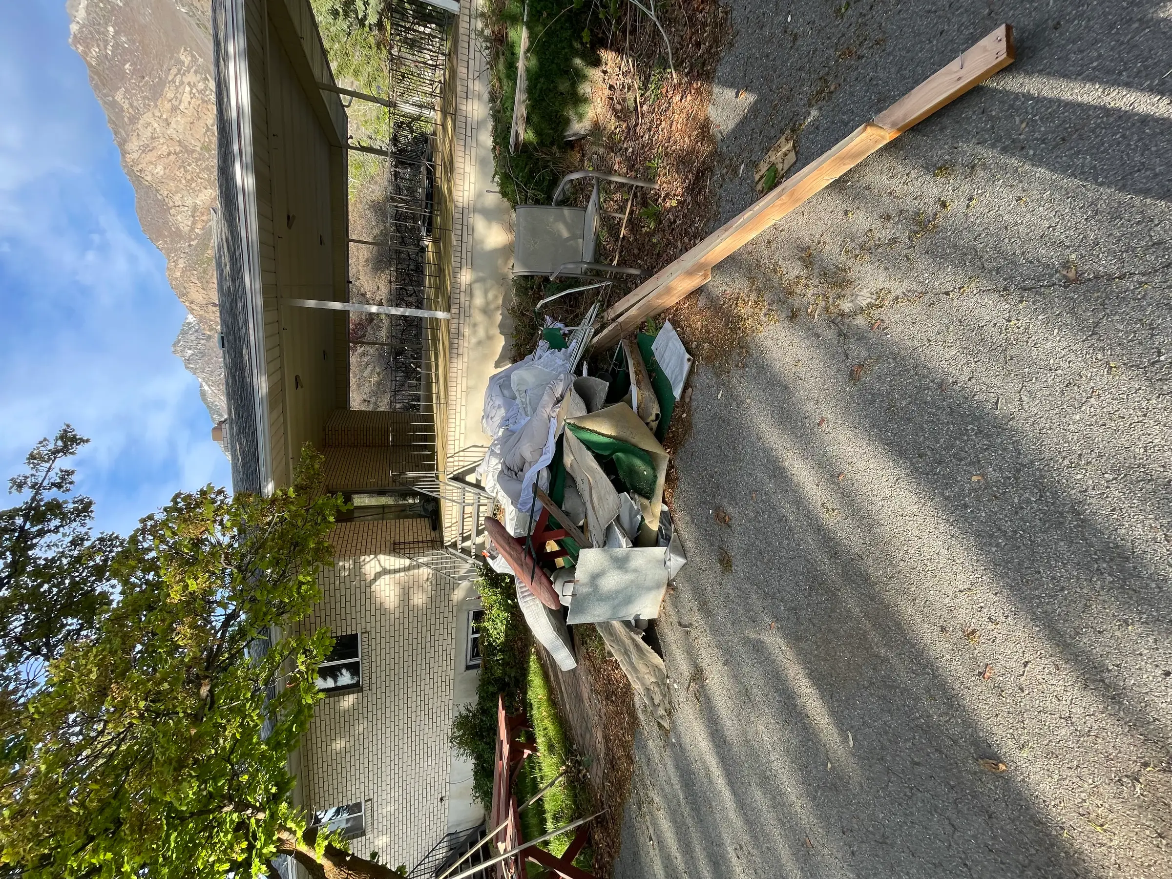 Construction and renovation debris pile staged for hauling in Utah County