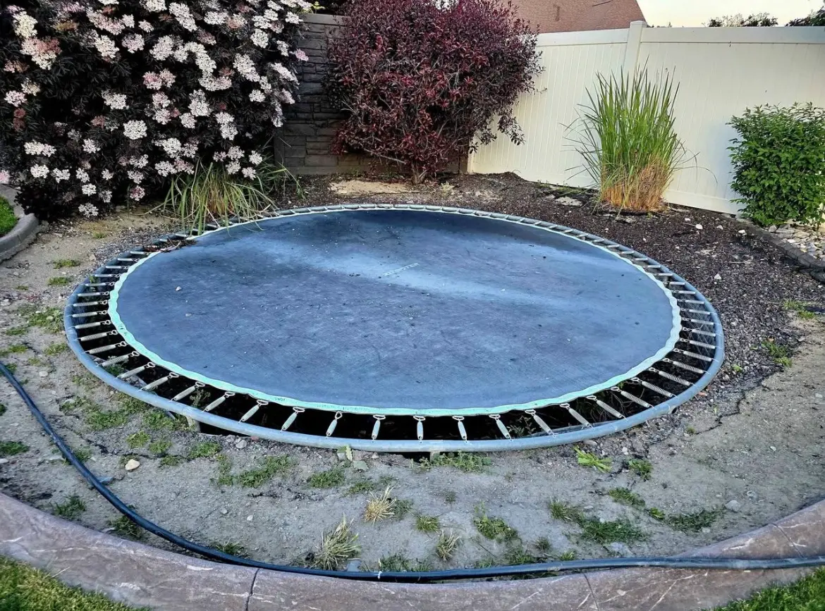 Backyard trampoline before removal in Utah County