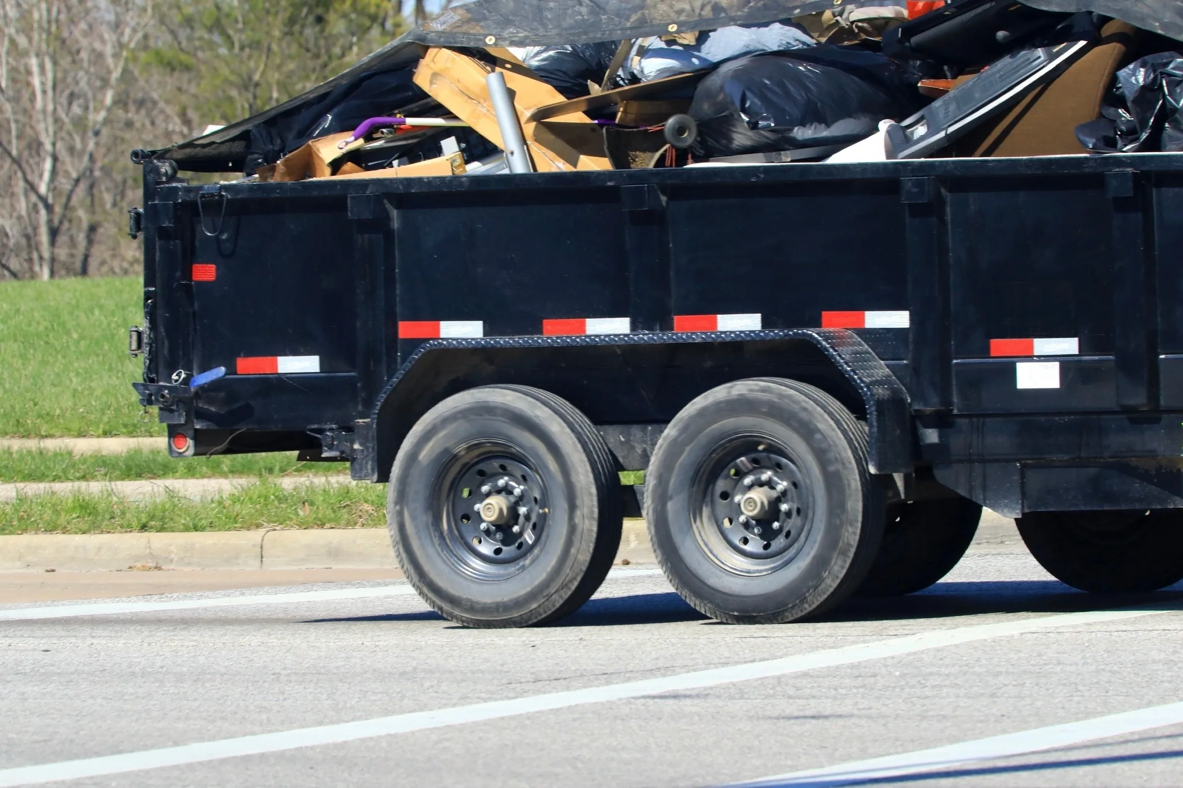 Utah County Hauling dump trailer loaded for a cleanup job